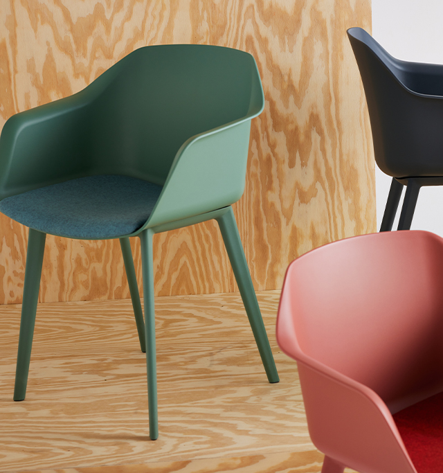 Coleurí poly chairs in 4 colors, with the middle chair in full upholstery with a wood base.