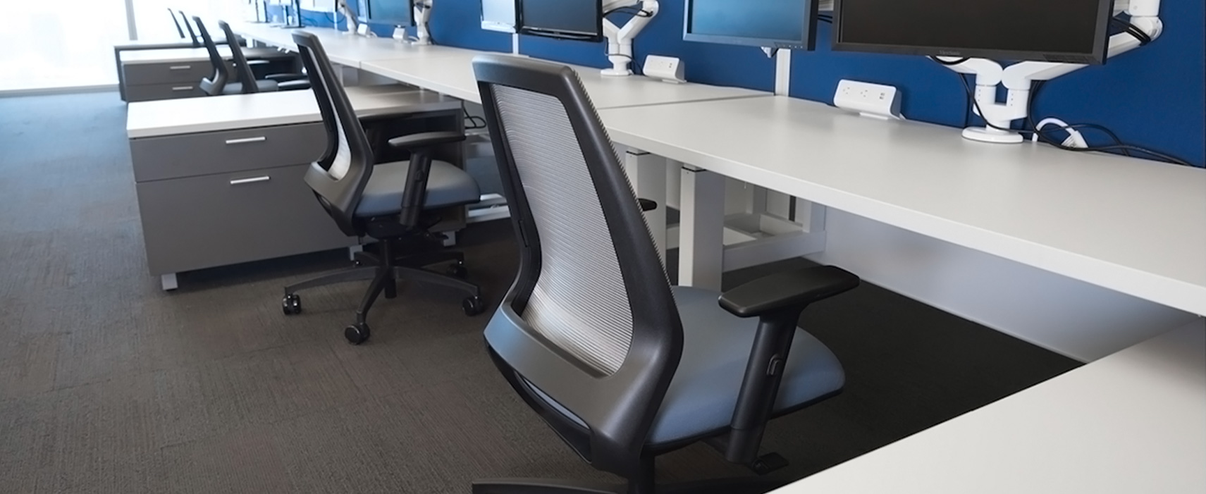 4u mesh back slim line seat work chairs in a medium sized office. (Photo: Rightsize Facility)